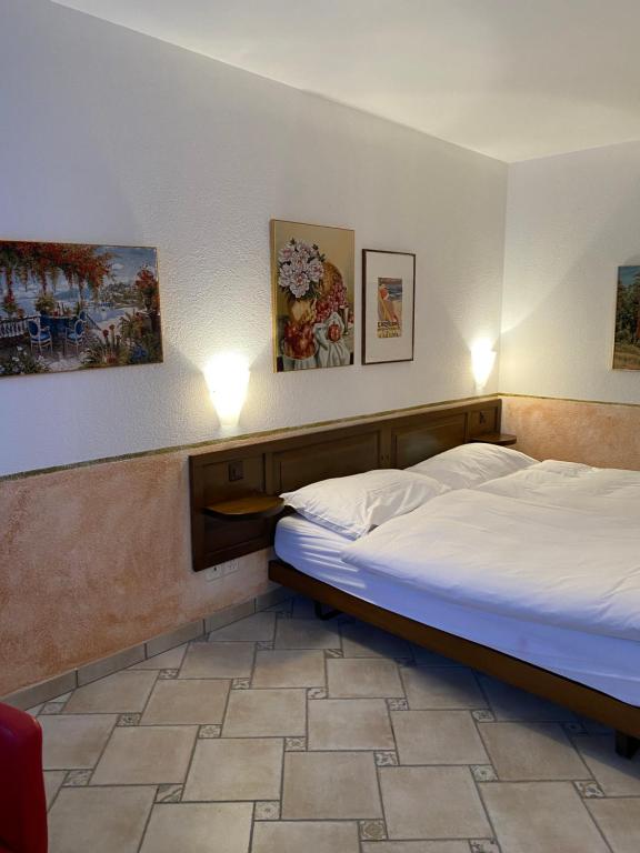 Postel nebo postele na pokoji v ubytování Hotel Antico