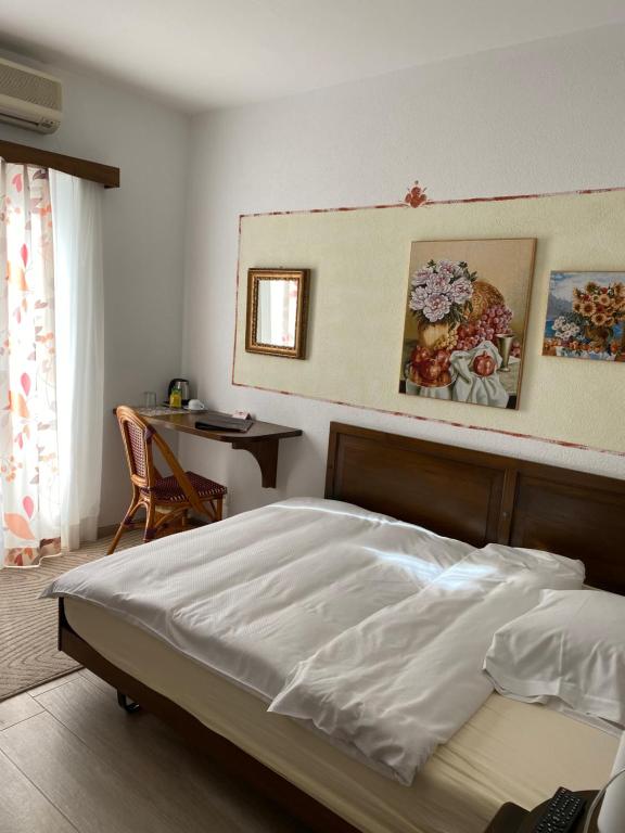 Postel nebo postele na pokoji v ubytování Hotel Antico