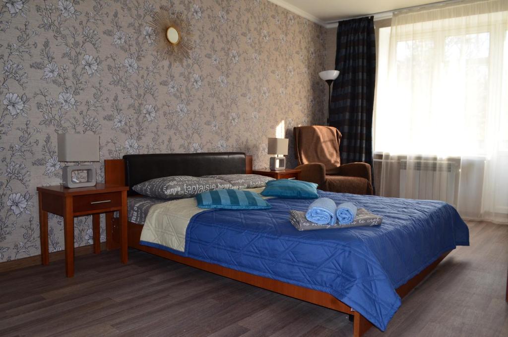  Кровать или кровати в номере Standard Brusnika Apartment Shchyukinskaya 