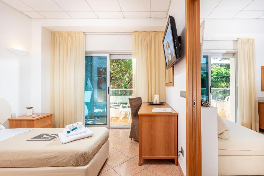 Postel nebo postele na pokoji v ubytování Hotel Rex
