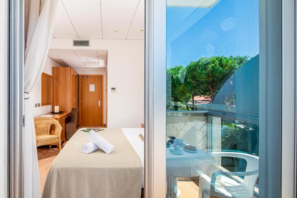 Postel nebo postele na pokoji v ubytování Hotel Rex