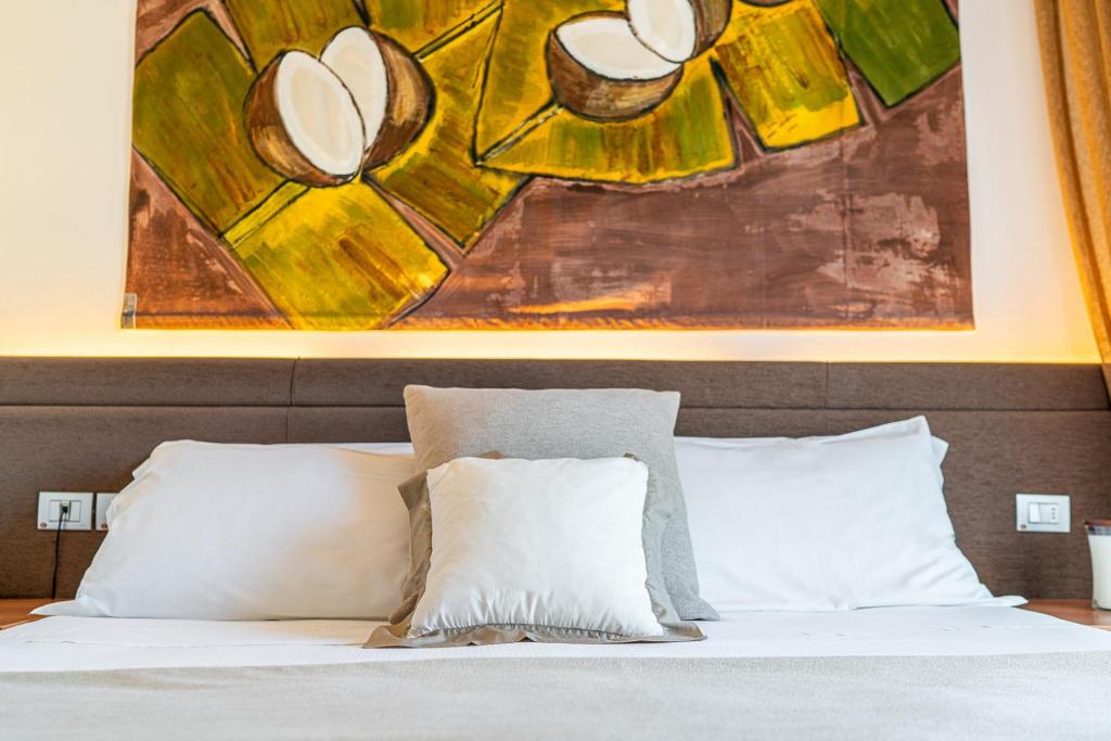 Postel nebo postele na pokoji v ubytování Hotel Rex