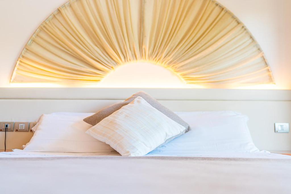 Postel nebo postele na pokoji v ubytování Hotel Rex