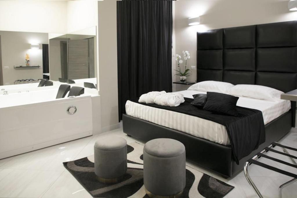 Postel nebo postele na pokoji v ubytování Hotel Trionfal