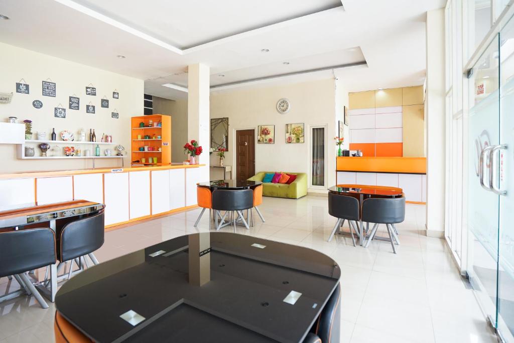 Posezení v ubytování Pratisarawirya Guesthouse by ecommerceloka