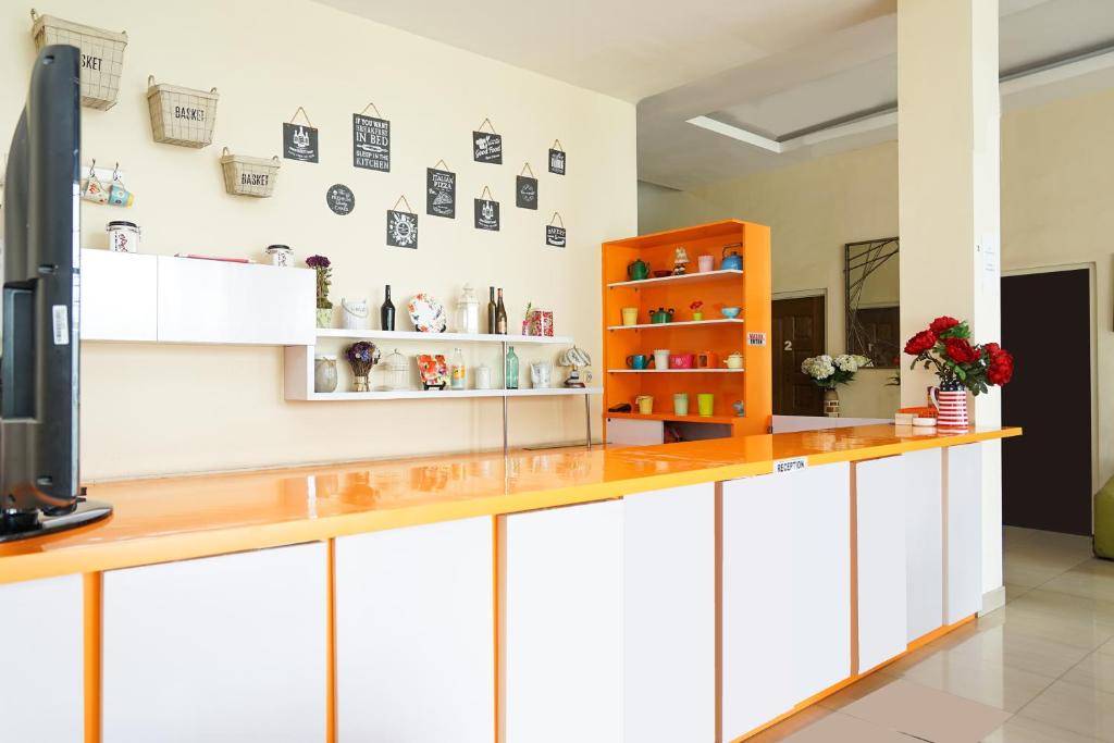 Kuchyň nebo kuchyňský kout v ubytování Pratisarawirya Guesthouse by ecommerceloka