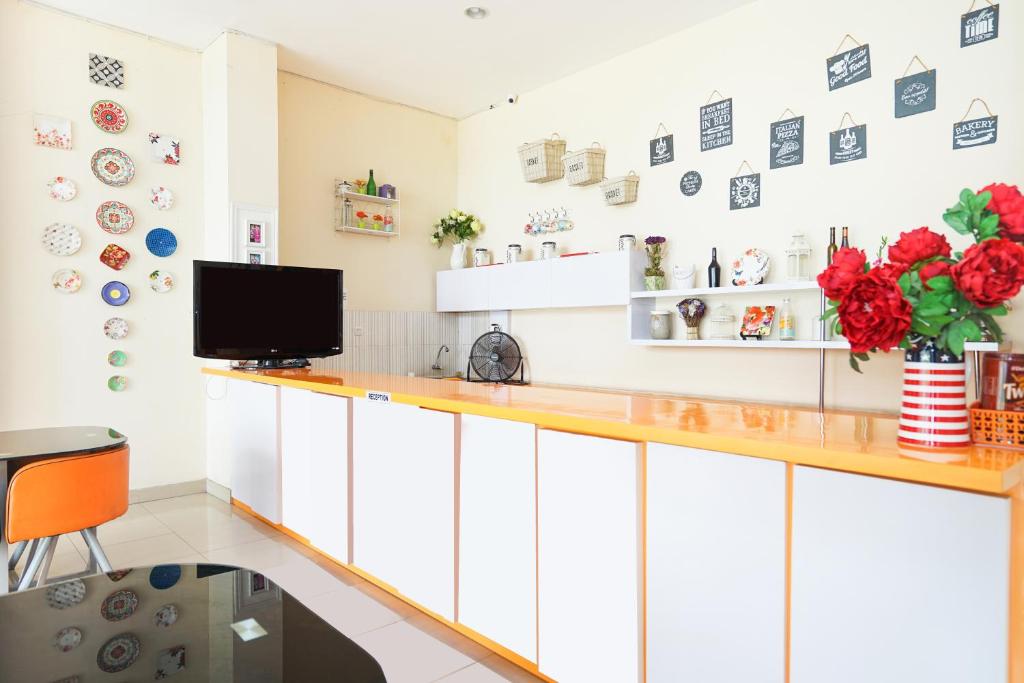 Kuchyň nebo kuchyňský kout v ubytování Pratisarawirya Guesthouse by ecommerceloka
