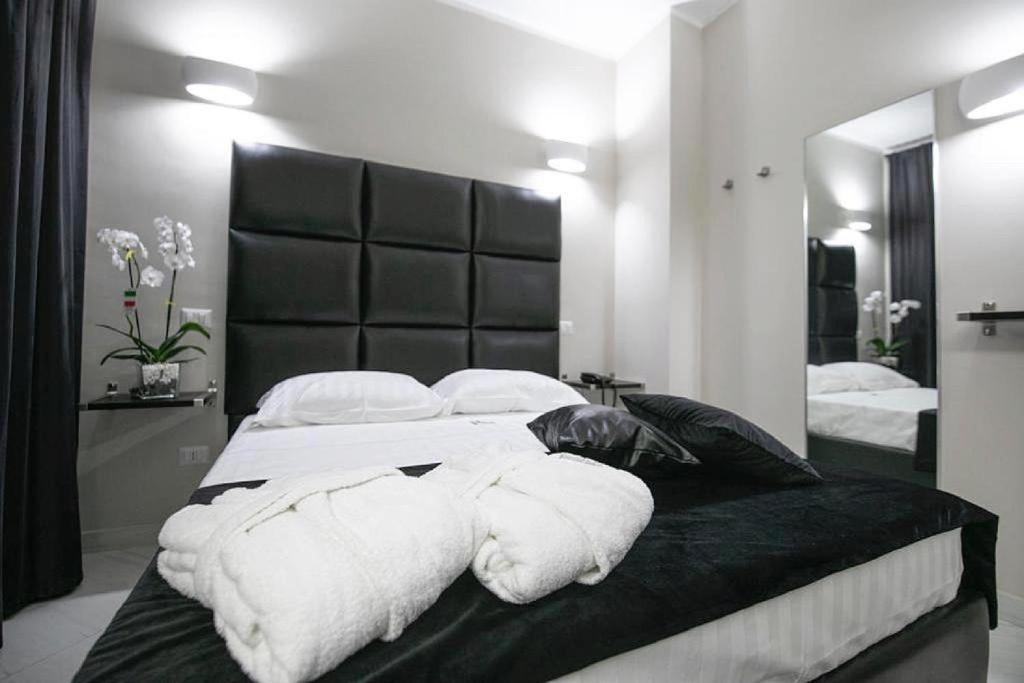 Postel nebo postele na pokoji v ubytování Hotel Trionfal