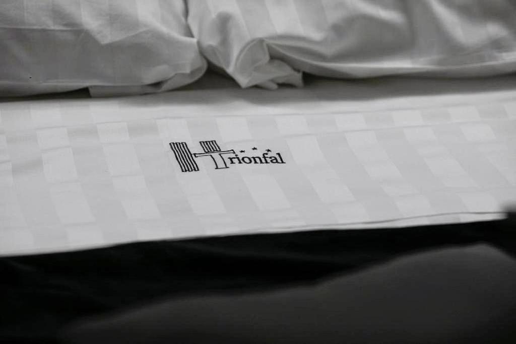Postel nebo postele na pokoji v ubytování Hotel Trionfal