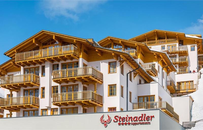 a building with balconies on the side of it at Fewo-Obertauern-Steinadler in Obertauern