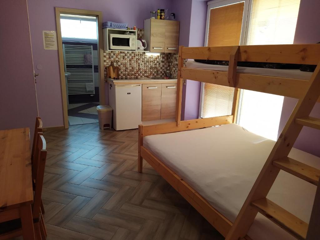 Postel nebo postele na pokoji v ubytování Apartments Klentnice U Mikulova