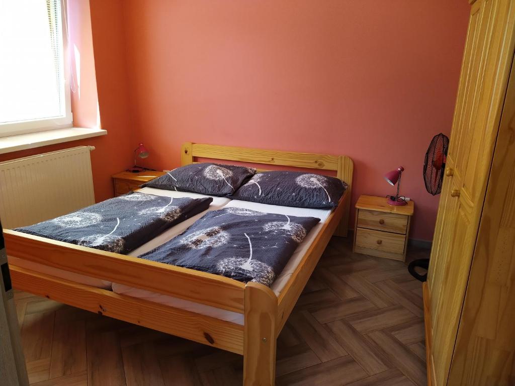 Postel nebo postele na pokoji v ubytování Apartments Klentnice U Mikulova