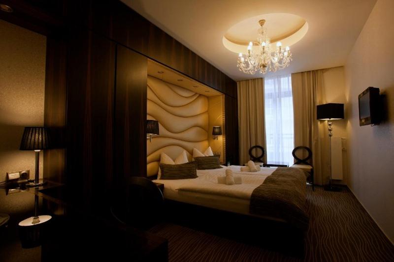 Postel nebo postele na pokoji v ubytování Hotel Ambiente Wellness & Spa