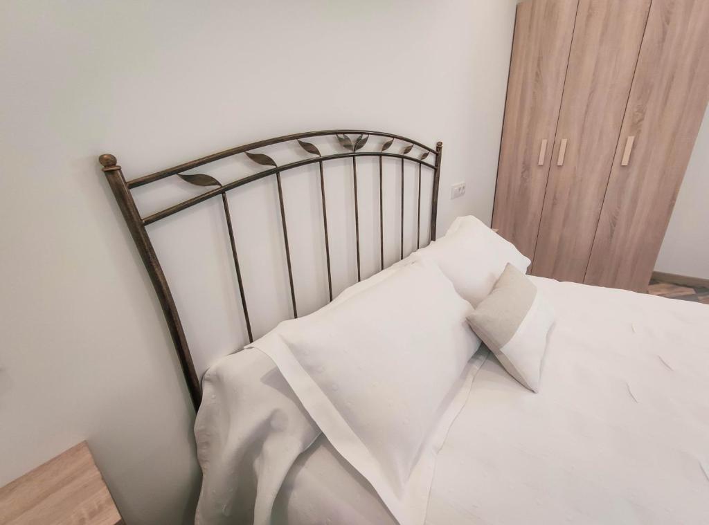 Postel nebo postele na pokoji v ubytování Hostal Óleo Auto Check-in