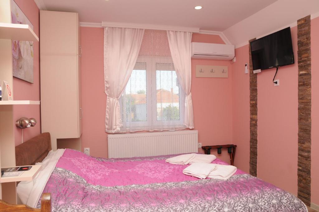 Postel nebo postele na pokoji v ubytování Favorit Apartments Čačak
