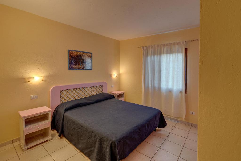 Ein Bett oder Betten in einem Zimmer der Unterkunft Baia de Bahas Residence
