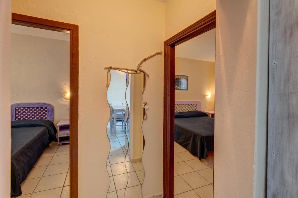 Ein Bett oder Betten in einem Zimmer der Unterkunft Baia de Bahas Residence