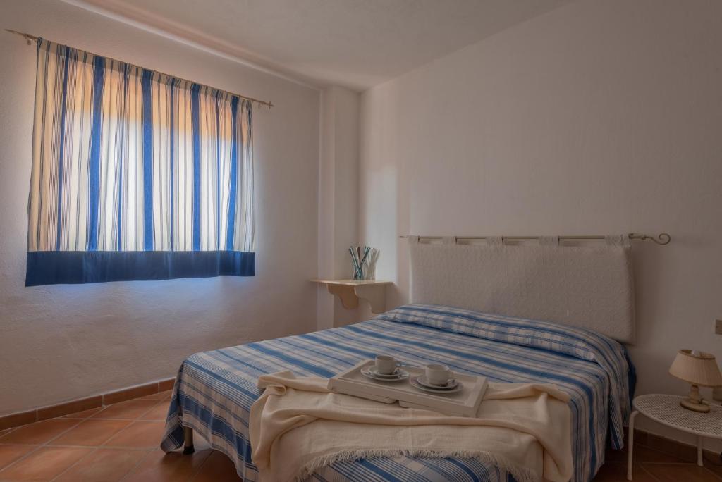 Ein Bett oder Betten in einem Zimmer der Unterkunft Baia de Bahas Residence