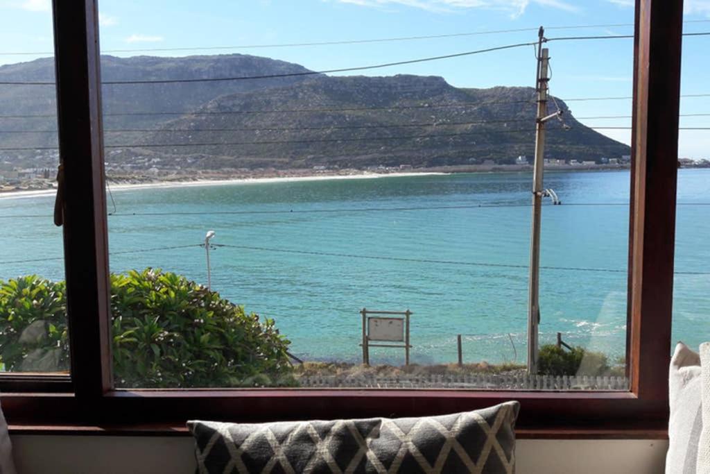 a view of the ocean from a window at Uitkyk in Fish hoek