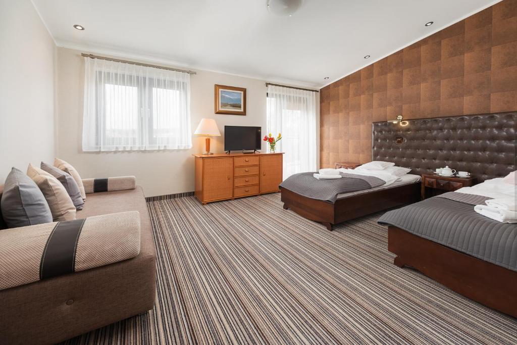 Postel nebo postele na pokoji v ubytování Hotel Rejs