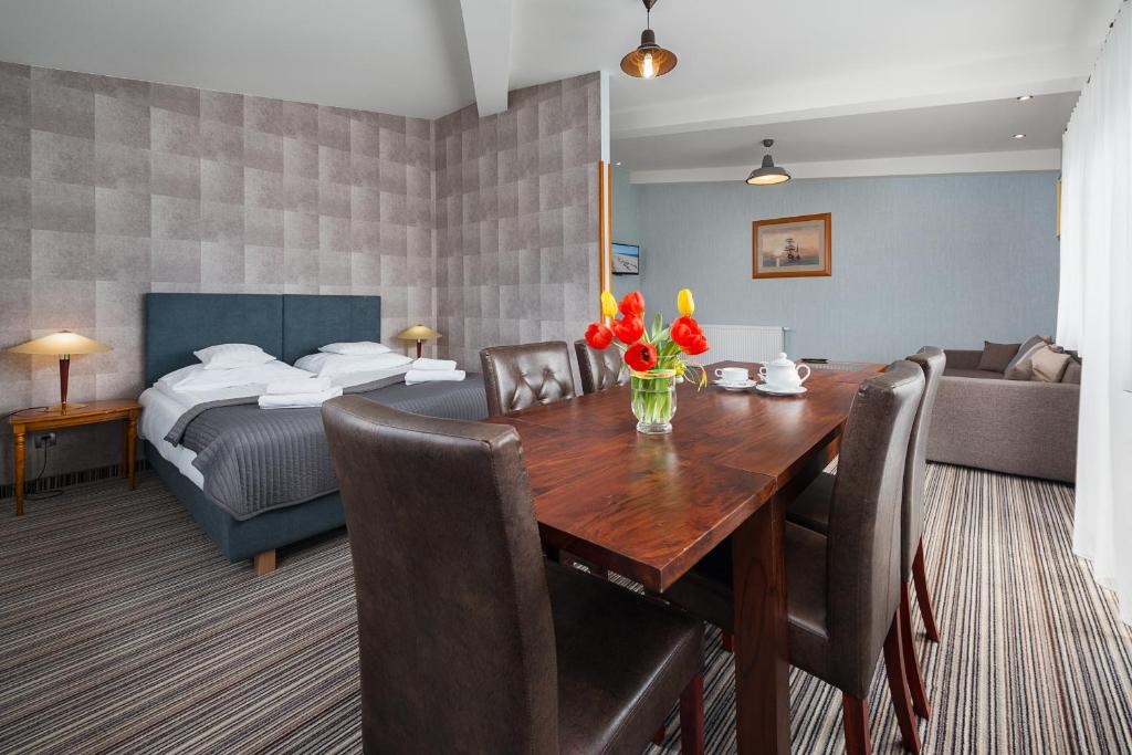 Postel nebo postele na pokoji v ubytování Hotel Rejs