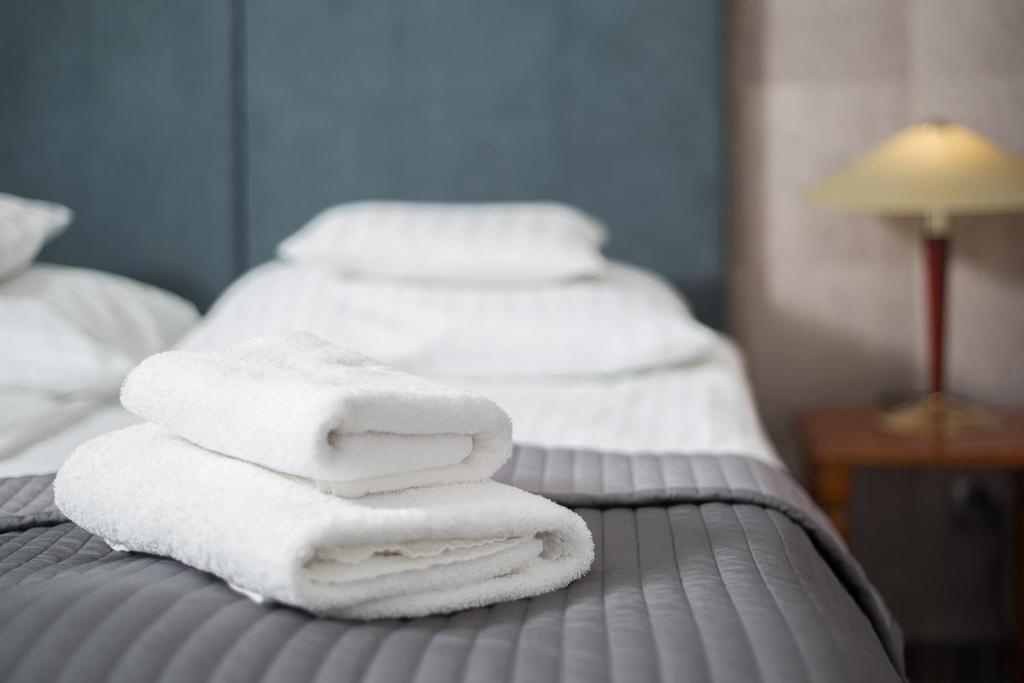 Postel nebo postele na pokoji v ubytování Hotel Rejs