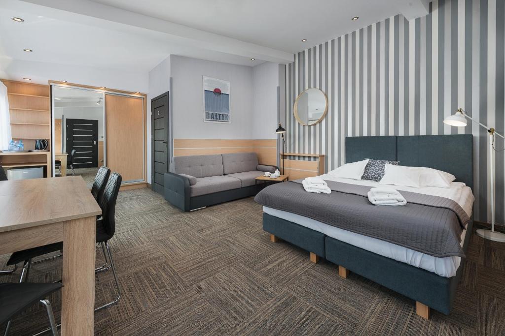 Postel nebo postele na pokoji v ubytování Hotel Rejs