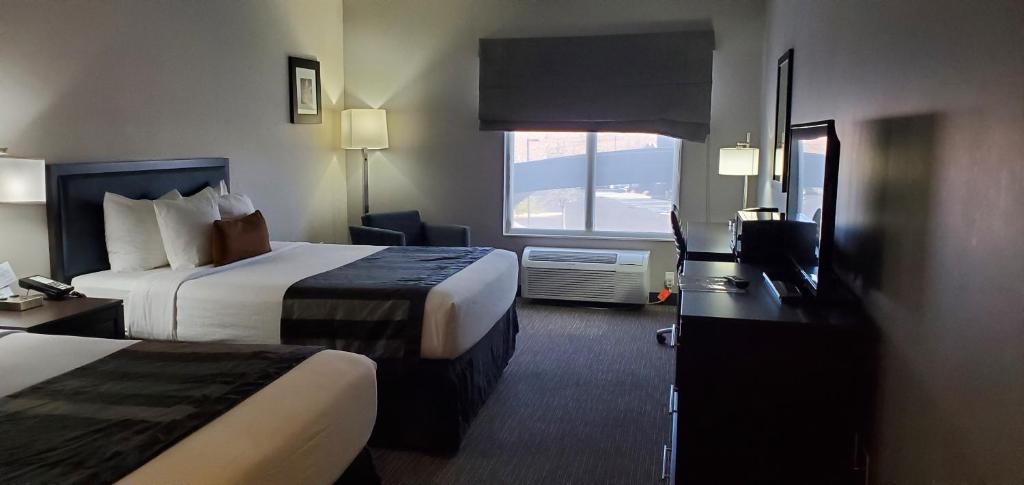 Ein Bett oder Betten in einem Zimmer der Unterkunft Wingate by Wyndham Page Lake Powell