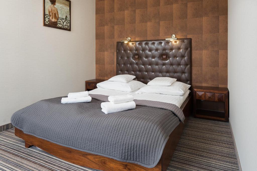 Postel nebo postele na pokoji v ubytování Hotel Rejs