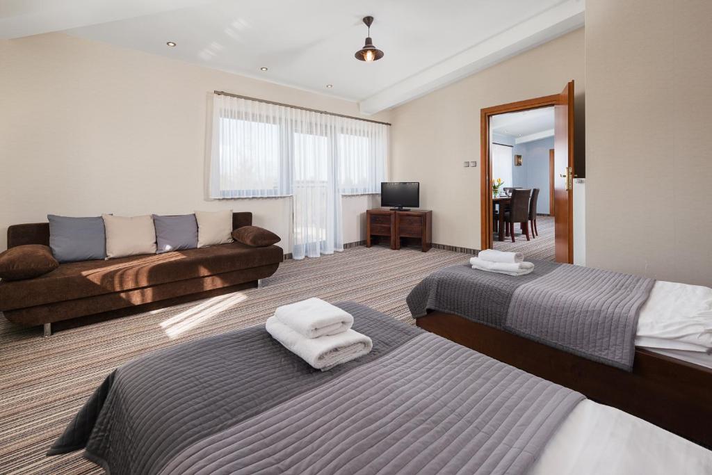 Postel nebo postele na pokoji v ubytování Hotel Rejs