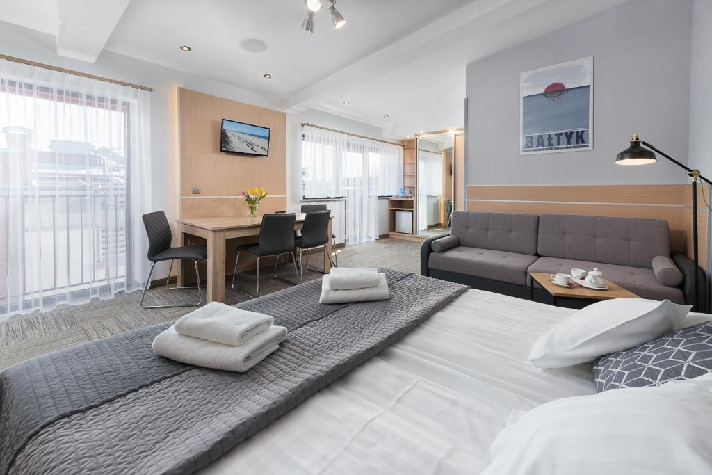 Postel nebo postele na pokoji v ubytování Hotel Rejs