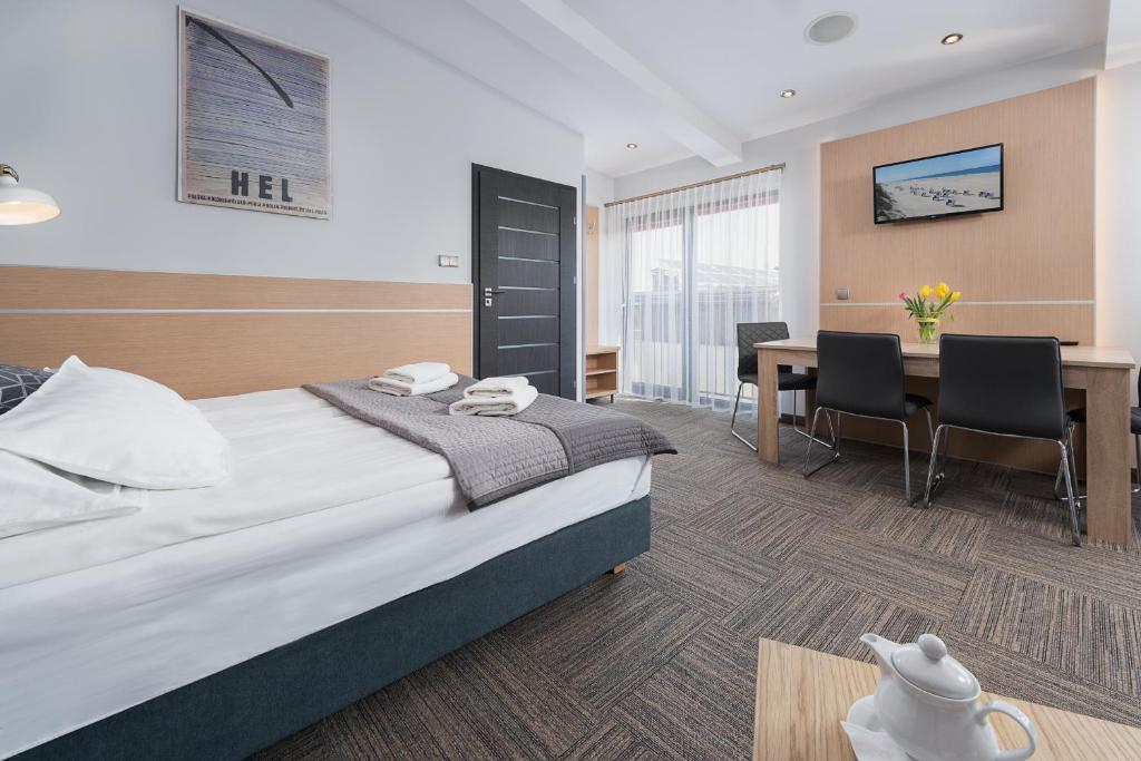 Postel nebo postele na pokoji v ubytování Hotel Rejs