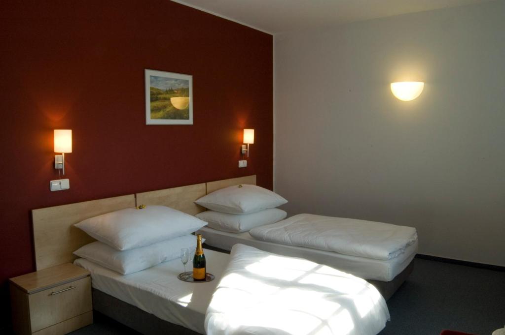 Postel nebo postele na pokoji v ubytování Hotel Chvalská Tvrz