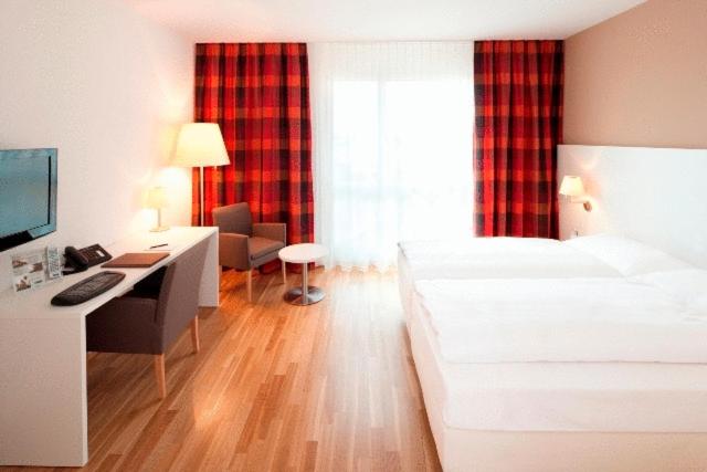 Postel nebo postele na pokoji v ubytování Hotel Arcade