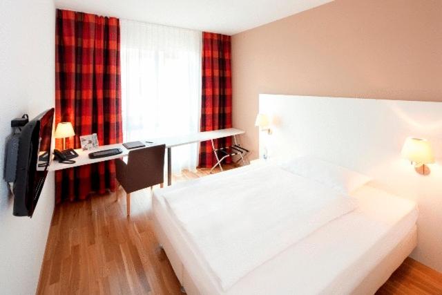 Postel nebo postele na pokoji v ubytování Hotel Arcade