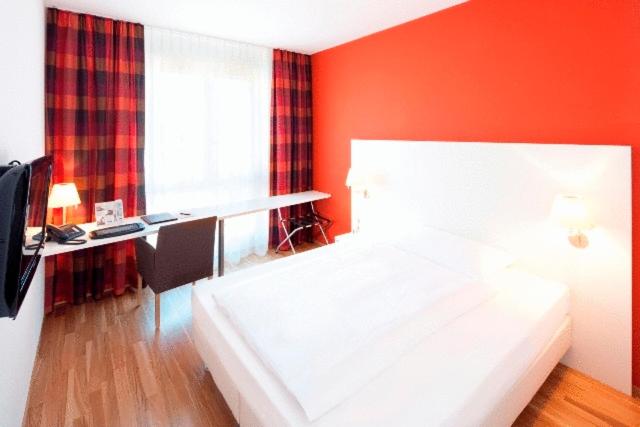 Postel nebo postele na pokoji v ubytování Hotel Arcade
