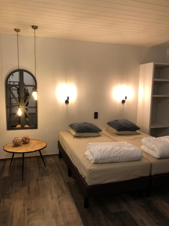 Postel nebo postele na pokoji v ubytování Domein Rietvelde