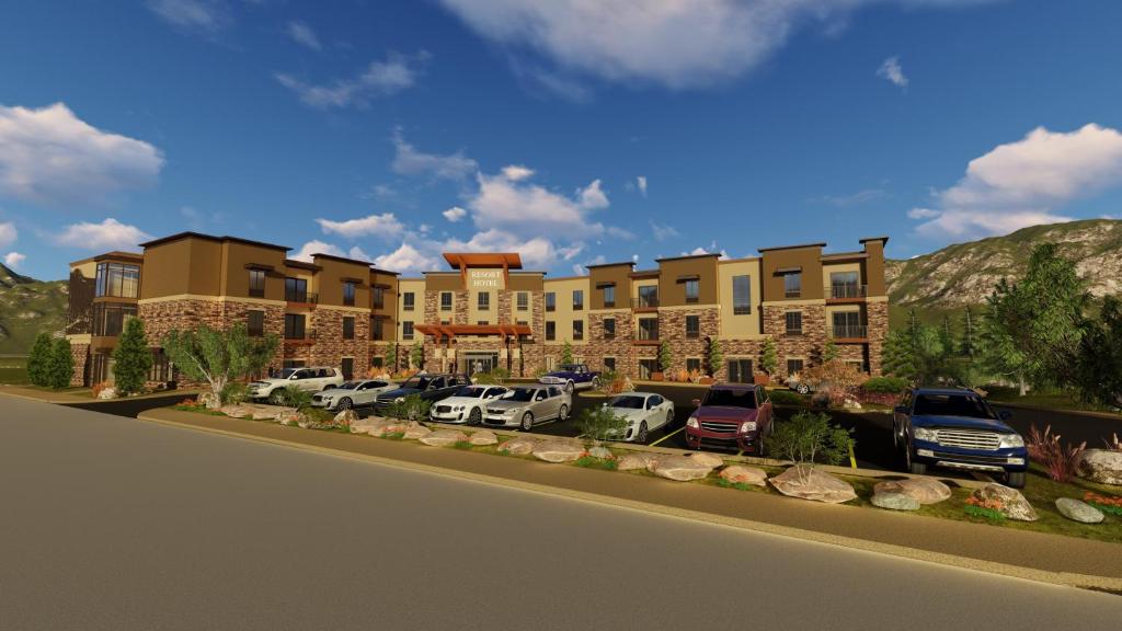 a rendering of a building with cars parked in a parking lot at Holiday Inn Express Durango Downtown- Animas River in Durango