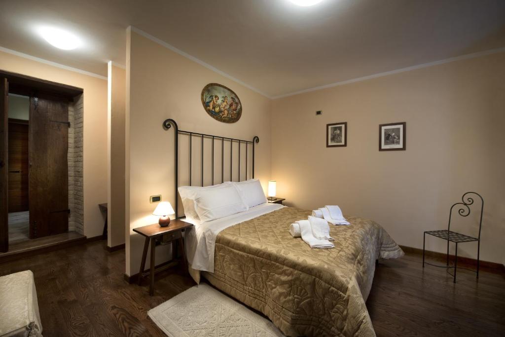 Postel nebo postele na pokoji v ubytování Torre di Cordaglie