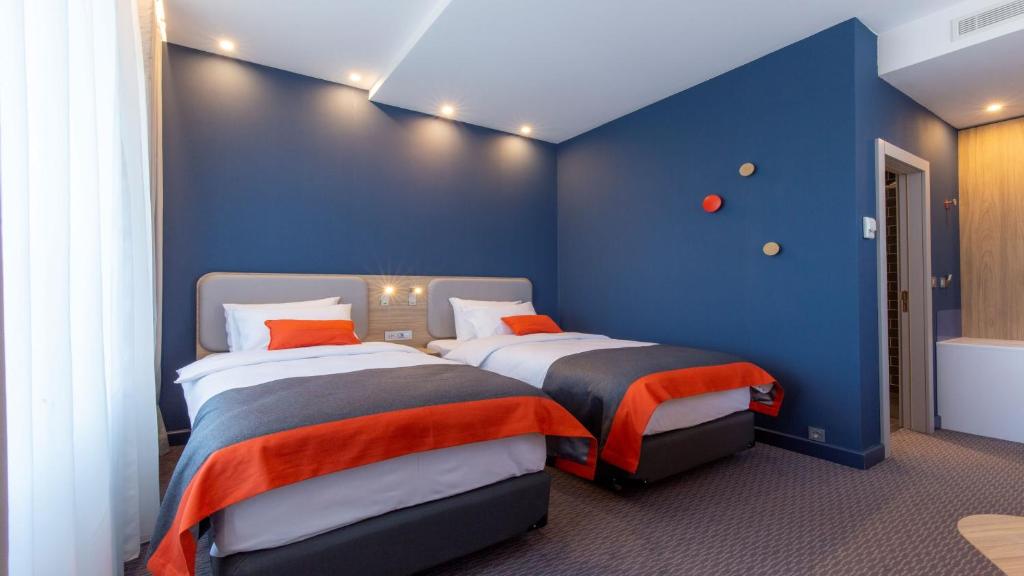 Postel nebo postele na pokoji v ubytování Holiday Inn Express - Ljubljana by IHG