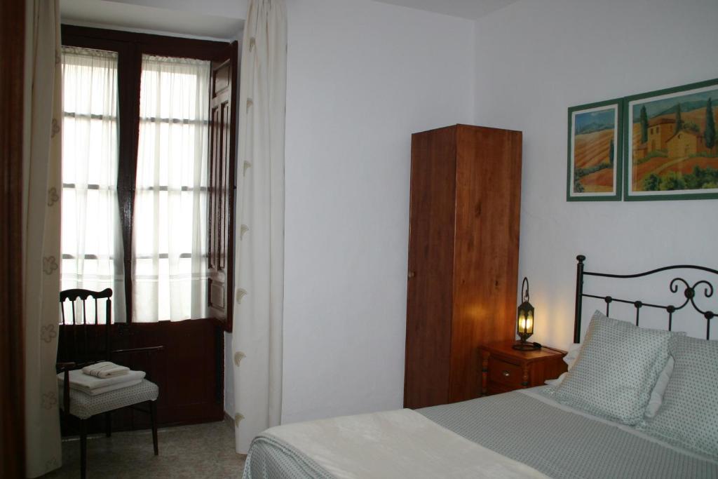 Cama o camas de una habitación en Pension el Portillo