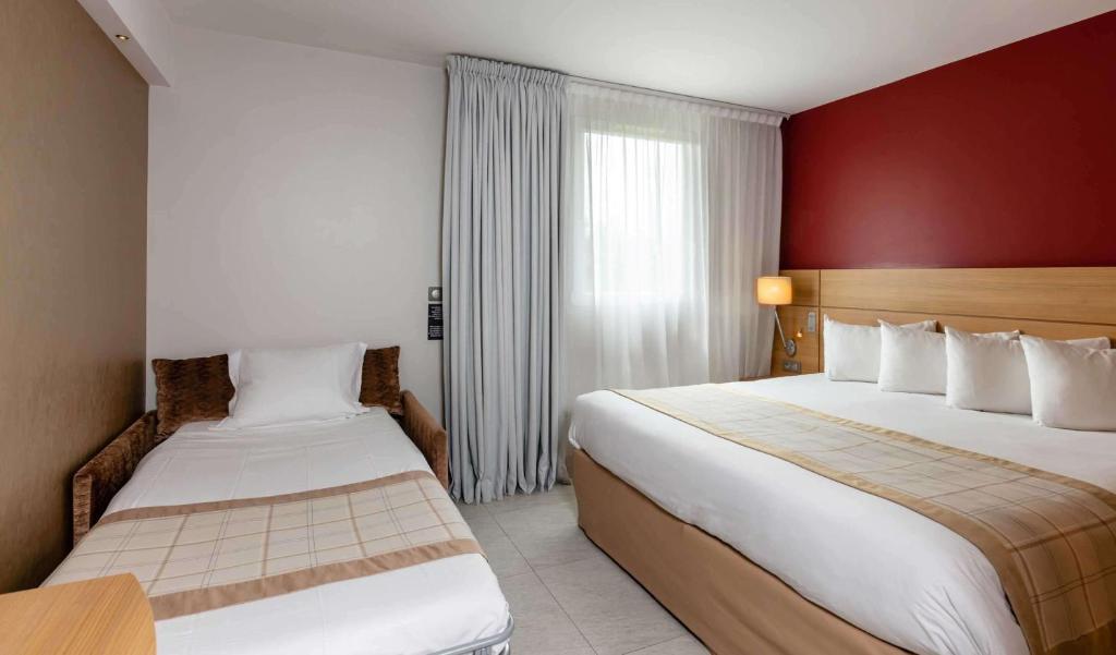 Postel nebo postele na pokoji v ubytování Best Western Plus Le Lavarin