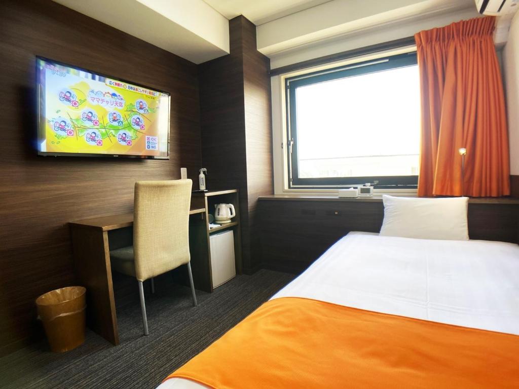 Postel nebo postele na pokoji v ubytování High Set HOTEL SHIZUOKA Inter