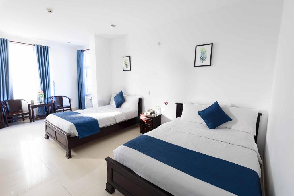 Postel nebo postele na pokoji v ubytování Tehana Beach Hotel Da Nang