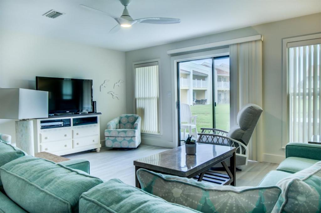 a living room with a couch and a tv at 2 C, Three Bedroom Townhome in Destin