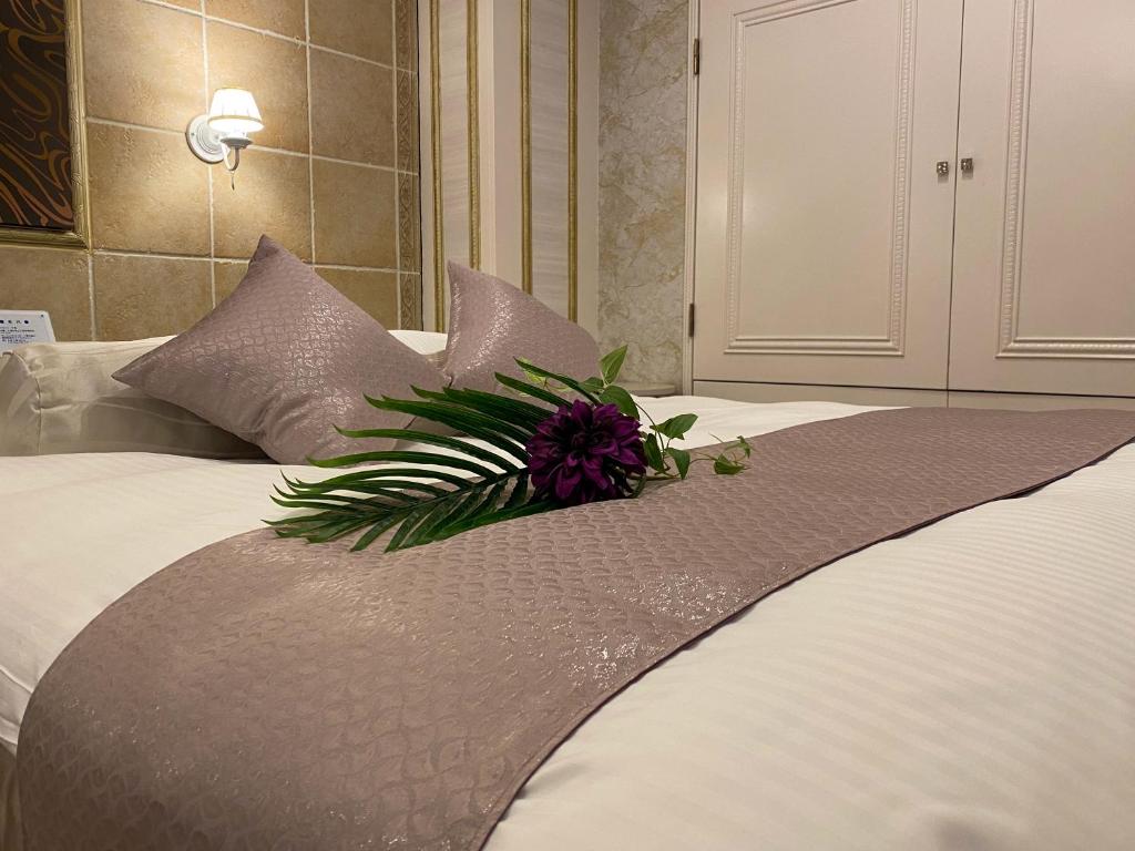 Postel nebo postele na pokoji v ubytování Hotel Venus Garden(Adult Only)