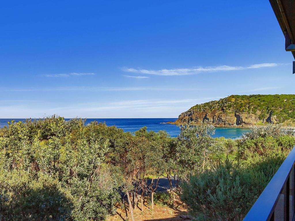 a view of the ocean from a house at Oceanside 04 Sea Bliss in Blueys Beach