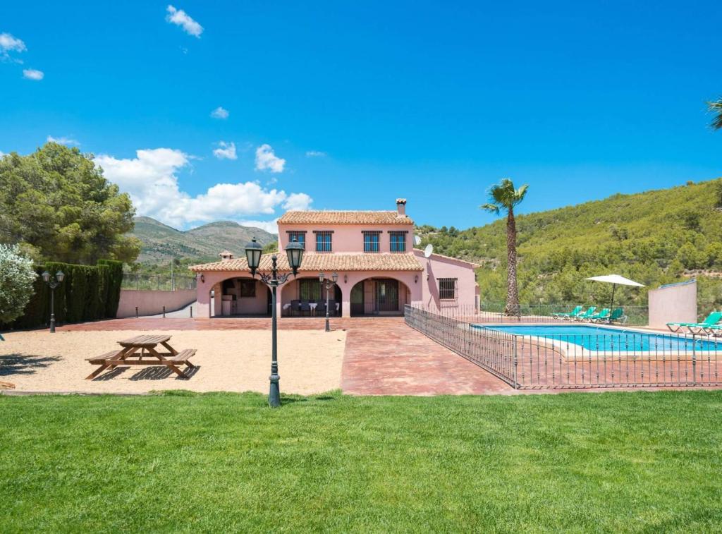 a villa with a swimming pool and a house at Villa Vinyent - Plusholidays in Calpe