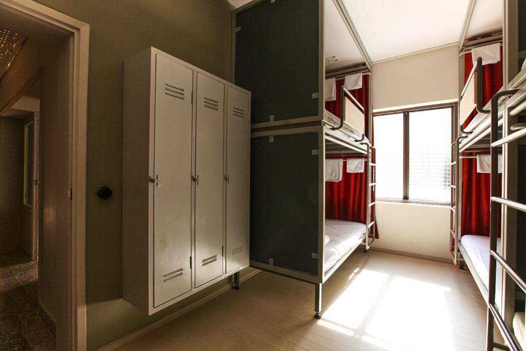 Postel nebo postele na pokoji v ubytování FLANEUR HOSTEL