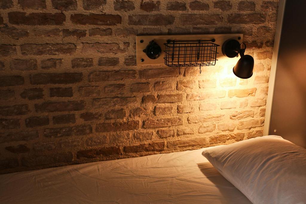 Postel nebo postele na pokoji v ubytování FLANEUR HOSTEL